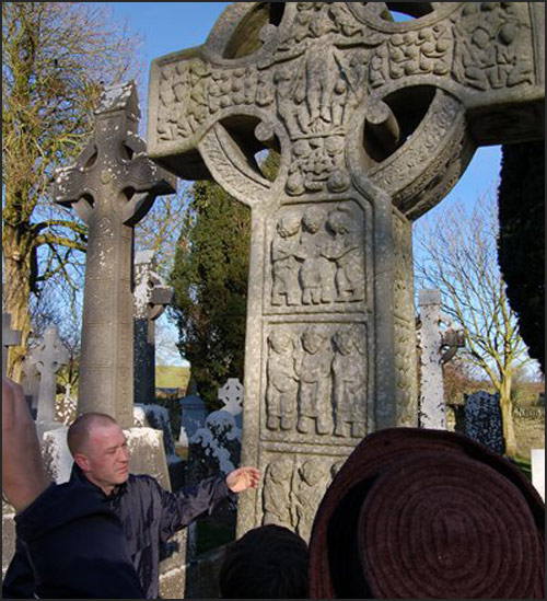 Kieran Cathcart speaking in front of celtic cross